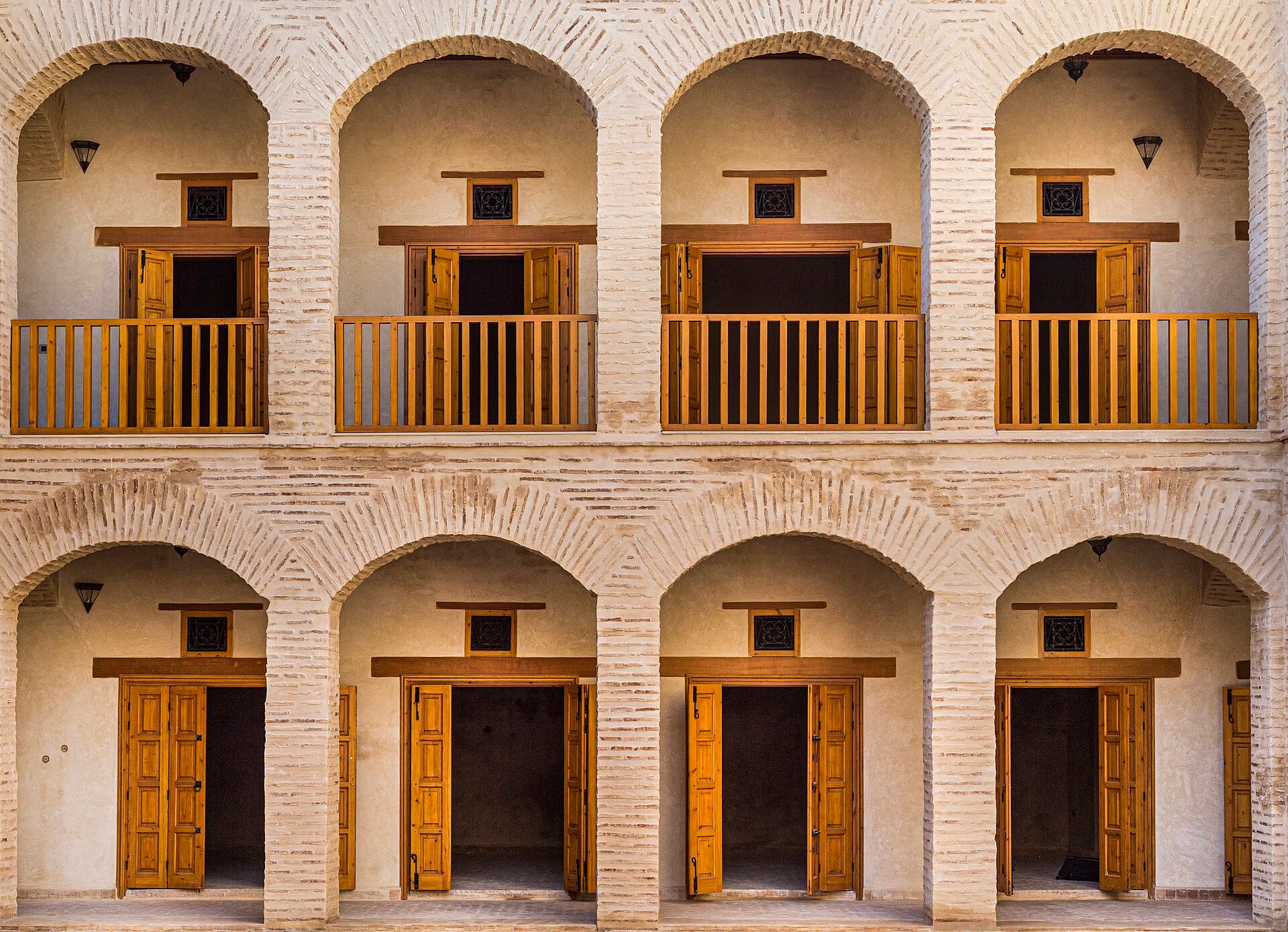 Interior arcaded galleries of a restored fondouk in Marrakech
